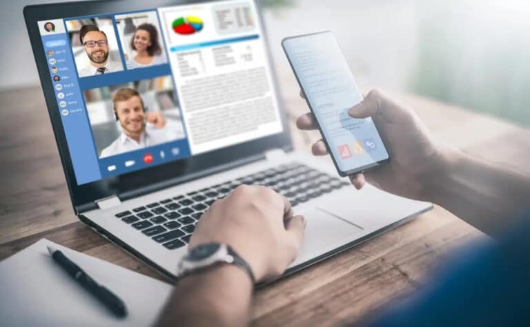 a person attending meeting on laptop and also scrolling mobile