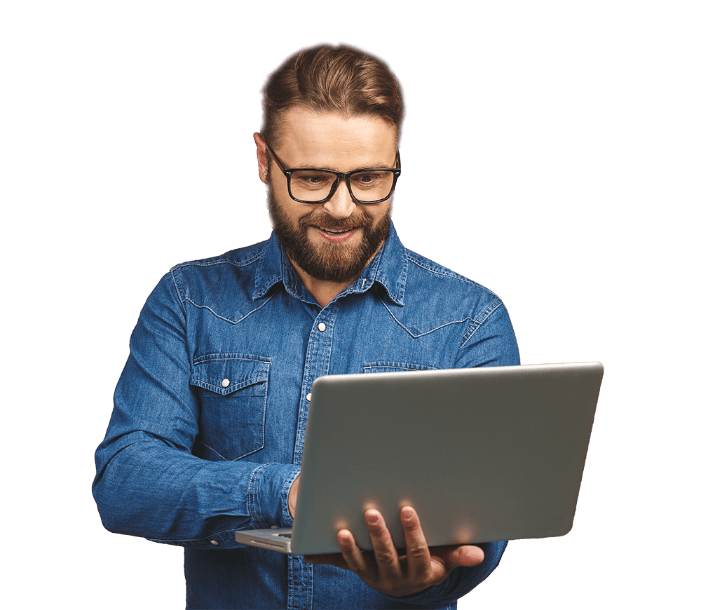 a techy man on standing position working on their laptop